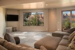 The downstairs family room has a flat screen TV